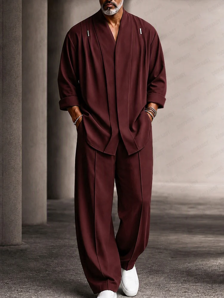 A fashion model wearing a wine-red Casual Relaxed Fit Shoulder Pleats Shirt Set from Coofandy, featuring shoulder pleats and a hidden button collar, highlighting an upscale men's Streetwear Style outfit for urban daily wear.