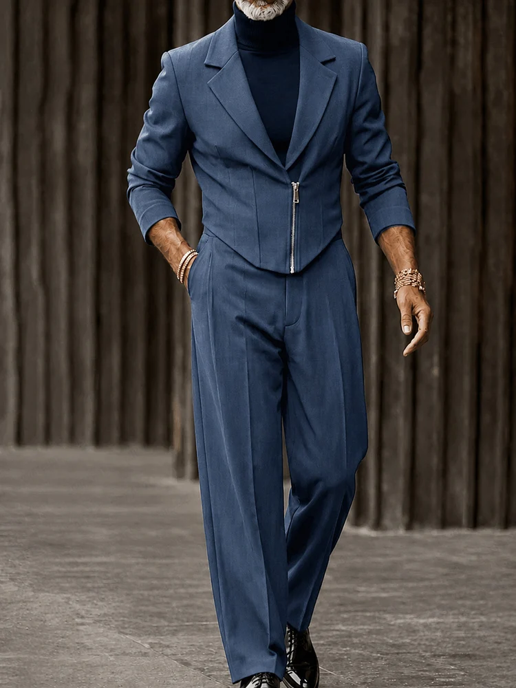 A fashion model wearing a blue Elevated Urban Cinched Blazer Pants Set from Coofandy, featuring a cropped zip-up blazer and a cinched waistline, highlighting a sophisticated men's Streetwear Style outfit for smart-casual events.